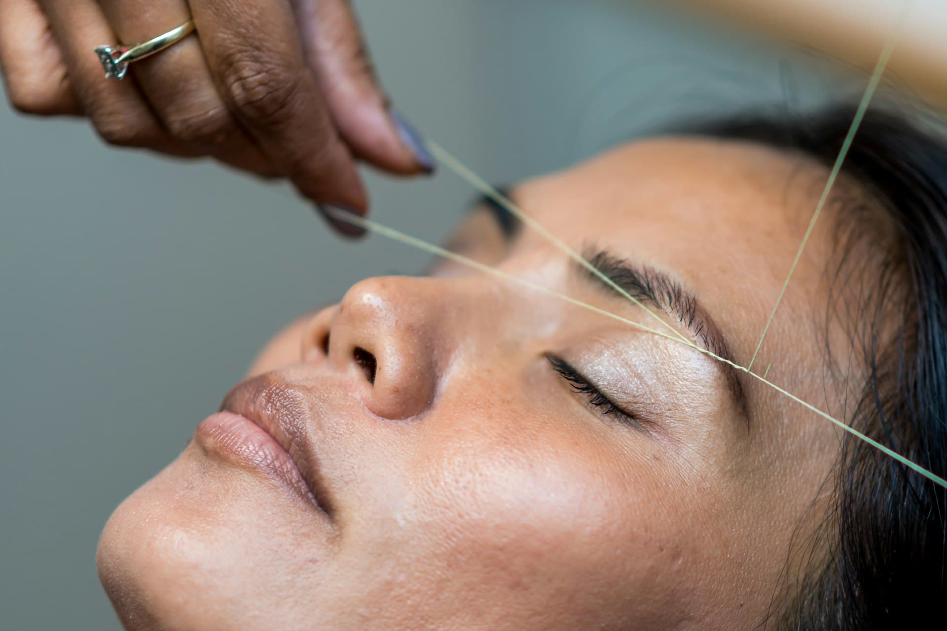 Professional brow shaping and tinting treatment